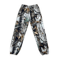 a pair of camouflage joggers on a black background